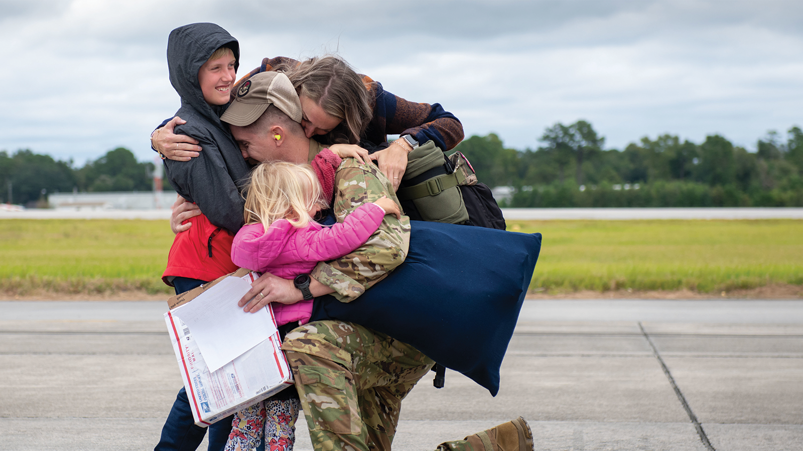 Military Family Hugging returned service member