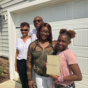 Family receives home through housing program.